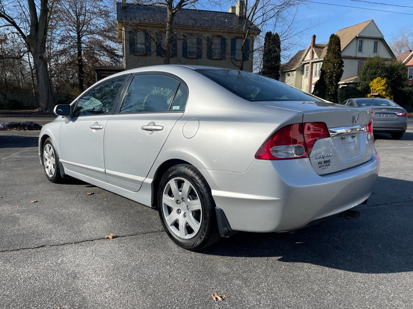 2009 silver Honda Civic LX Sedan 5-Speed AT (2HGFA16529H) with an 1.8L L4 SOHC 16V engine, 5-Speed Automatic transmission, located at 101 N. Main Street, Muncy, PA, 17756, (570) 546-5462, 41.207691, -76.785942 - Photo#2